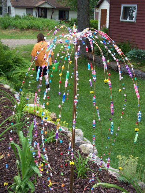 Garden hose wreath garden crafts garden projects diy projects garden tools diy wreath door wreaths wreath making garden hose wreath arte floral 50 best glass beads garden art images on Pinterest ...