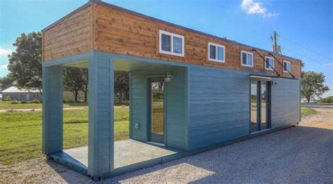 This Amazing Tiny Home With Porch Is Actually A 40 Foot Shipping