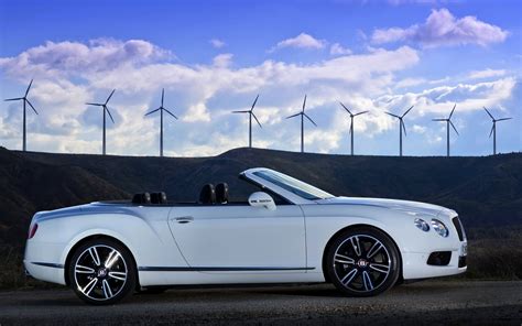 1366x768 Resolution White Bentley Convertible Park On Concrete Road