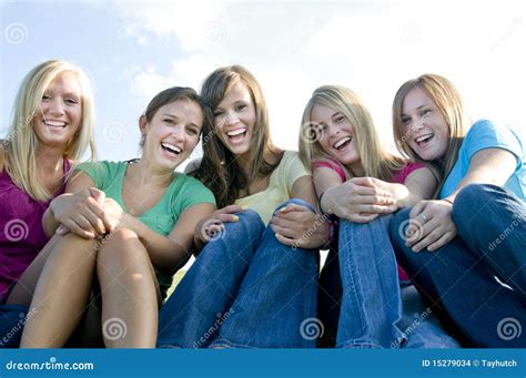 5 Girls Sitting Together And Laughing Stock Photo Image Of Shirt