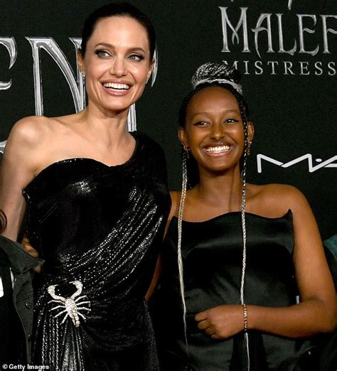 It looks to others like a letter m. but it wasn't an m for marcheline, her name. Angelina Jolie stuns in black gown as she brings kids to ...