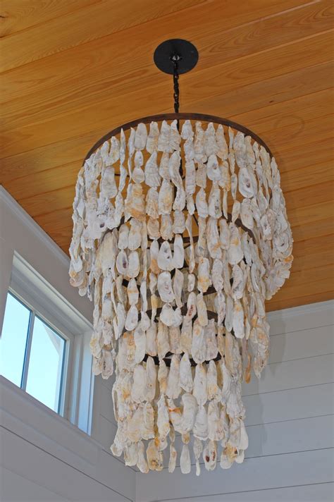 tiered oyster shell chandelier  mended metals llc