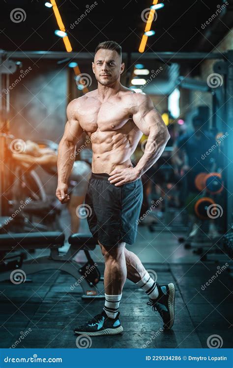 Muscular Bodybuilder Male With Perfect Body Have Workout And Posing In