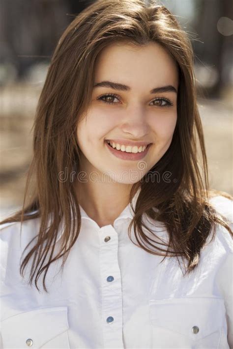 Young Beautiful Brunette Girl In White Shirt Posing On Spring Park Stock Image Image Of Close
