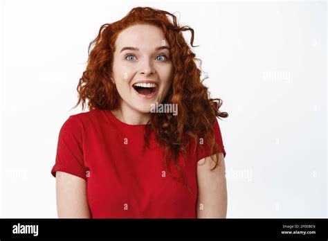 Close Up Of Excited Happy Ginger Girl Gasping Fascinated Looking Aside At Logo That Capturing