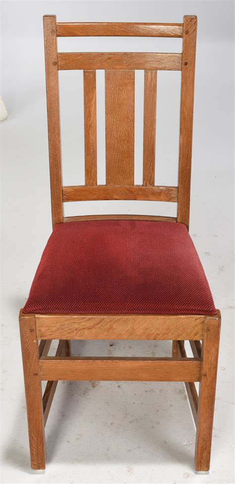 Fine example of an arts and crafts oak framed porters or concierge chair. Brunk Auctions