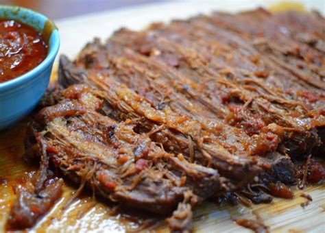 The brisket is meltingly tender from the long cooking simply slice the meat, then store it in the sauce. Dutch Oven Barbecue Beef Brisket | Small Town Woman