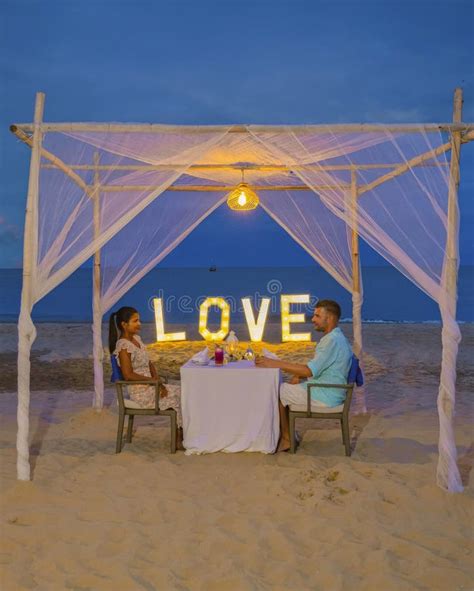 Romantic Dinner On The Beach In Phuket Thailand Couple Man And Woman Having Dinner On The Beach