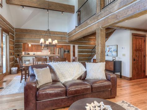 A dishwasher, a microwave and fridge are also featured in the kitchen, as well as a coffee machine. Big Sky Cabins | Powder Ridge Ski In/Ski Out
