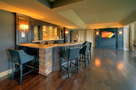 A Large Open Floor Plan With Bar Seating And Wood Floors Along With An