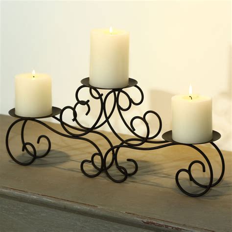 This Sleigh Style Candle Holder Displays Three Pillar Candles Of Any Height On A Two Tier