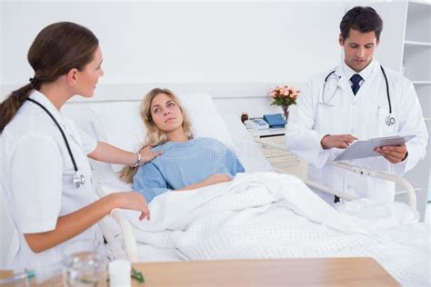 Doctor Taking Care Of A Patient Stock Photo Image Of Holding
