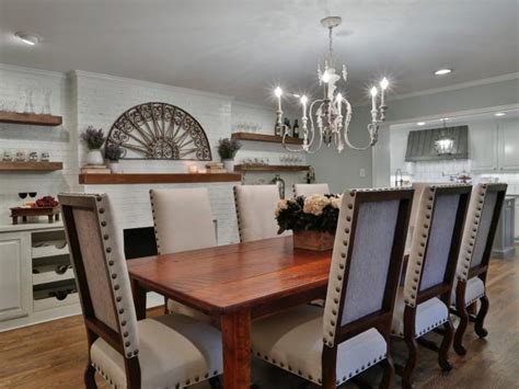 Nailhead Chairs And Rustic Chandelier In French Country
