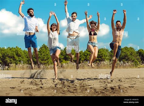 Group Of Friends Together On The Beach Having Fun Stock Photo Alamy