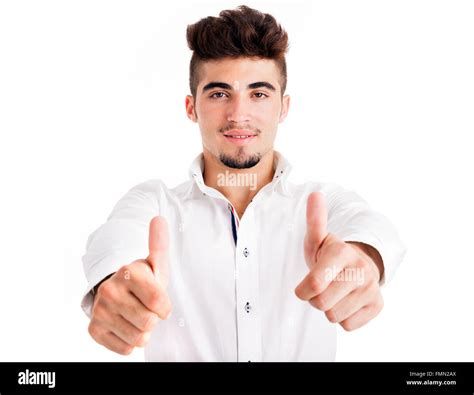 Smiling Handsome Young Man Thumbs Up On White Background Stock Photo
