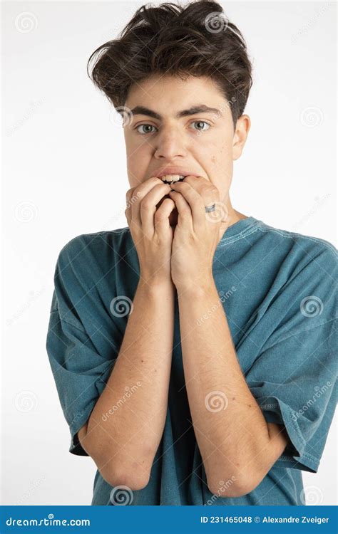 Portrait Of Young Boy Distressed And Full Of Fear Scared Stock Photo