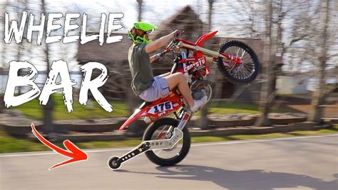 Begin the approach to doing a wheelie in a higher gear and pedal faster. WHEELIE BAR FOR DIRT BIKES!!