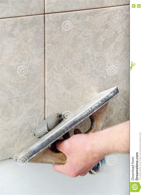 Fill The Tile Joints With Grout Stock Photo Image Of Grout Rubbing