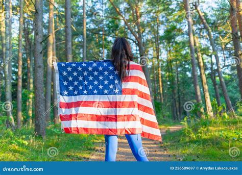 Beautiful Girl With American Flagsexy Caucasian Girl With American Flag In Hands On Summer