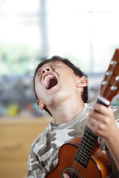 Boy Playing Guitar Stock Photo Image Of Concentration 26123968