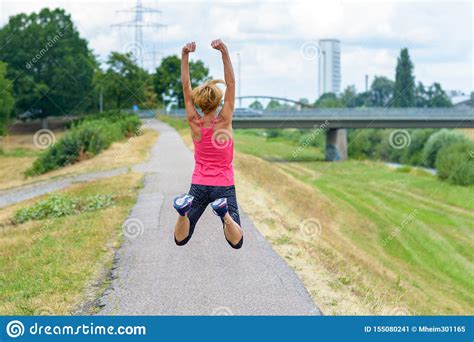 Fit Woman Full Of Vitality Leaping In The Air Stock Image Image Of