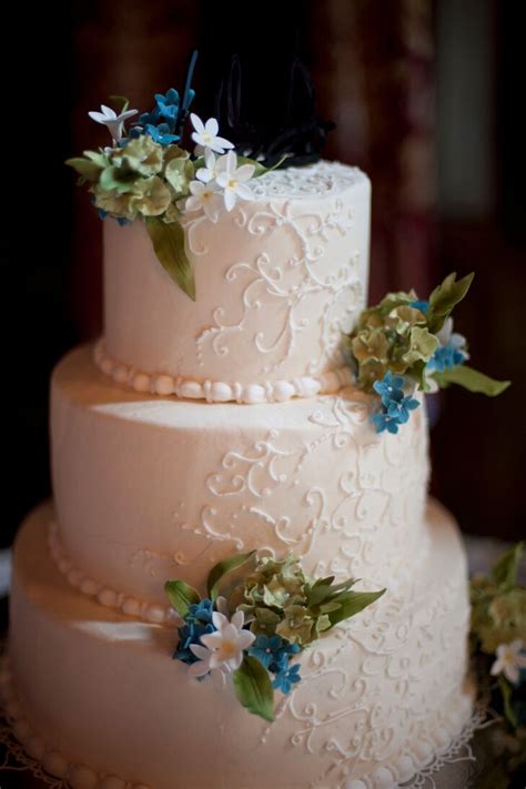 Ivory Wedding Cake With Green Blue And White Flowers