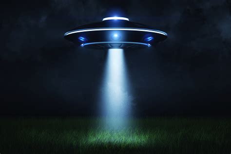 3d Rendering Of A Ufo At Night With A Beam Of Light Coming Out Of The