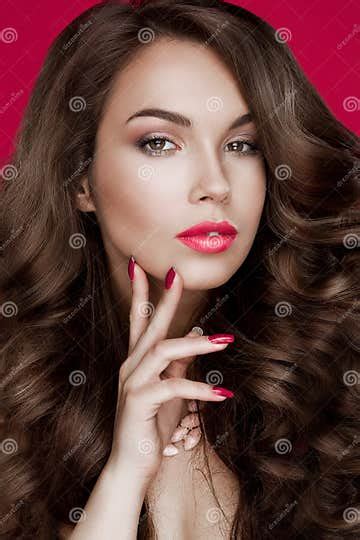 Girl Fashion Model With Bright Makeup And Red Manicure On The Nails Lips Jewelry Accessories