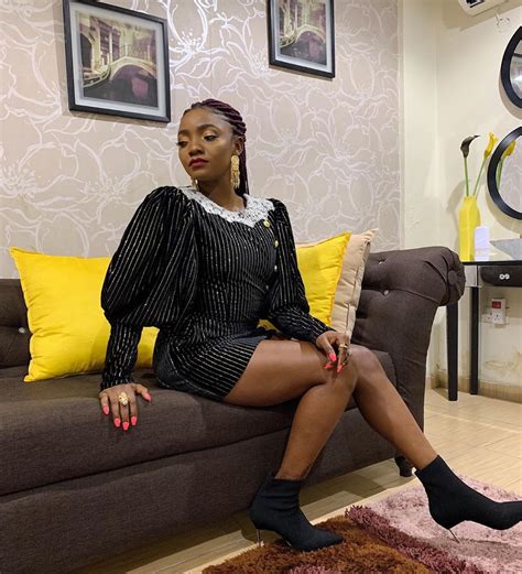 Simi Shows Off Her Swag In Ripped Bum Dress