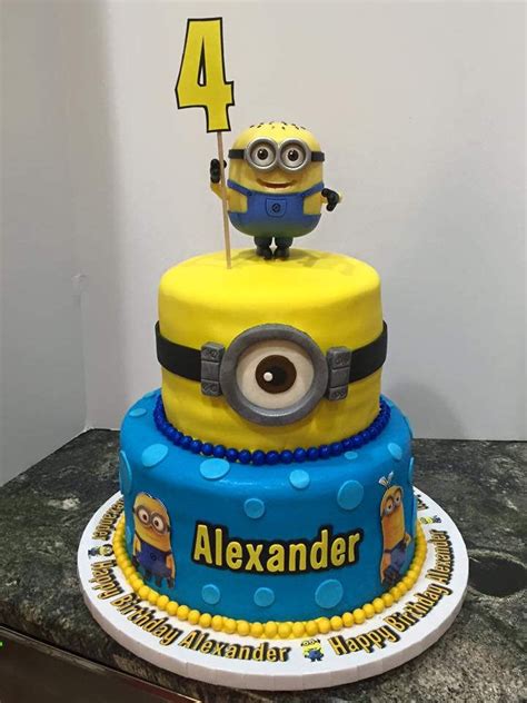 Double sided minion wedding cake minions to the back, royal blue and white them with white minions cake this was for my nephews 5th birthday, it took a long time to hand make all those. minion 2 tier birthday cake | Minion birthday cake, Tiered ...