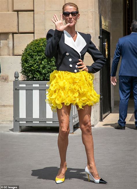 Céline Dion puts on a leggy display in a frilly miniskirt in Paris