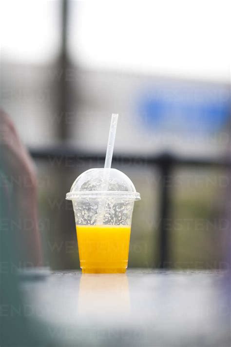 Plastic Cup With Orange Juice Stock Photo