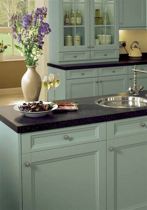 We specialise in bespoke handmade and hand painted kitchens. Arundle duck egg painted kitchen cabinets - I believe this pic shows what a difference the wax ...