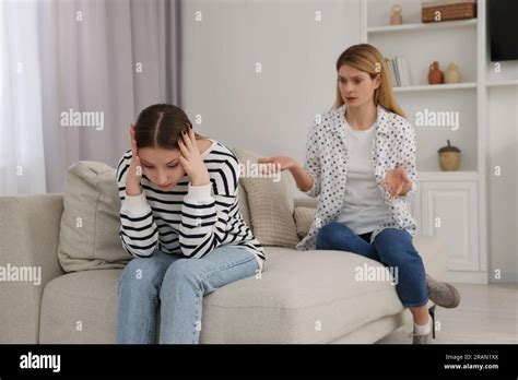 Mother Scolding Her Teenage Daughter At Home Stock Photo Alamy