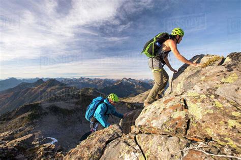 Backpackers Scramble Up Douglas Peak British Columbia Stock Photo