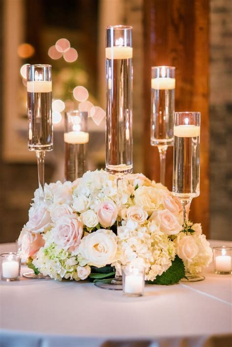 Low Lush Centerpiece Using Ivory And Blush Roses With Hydrangea And