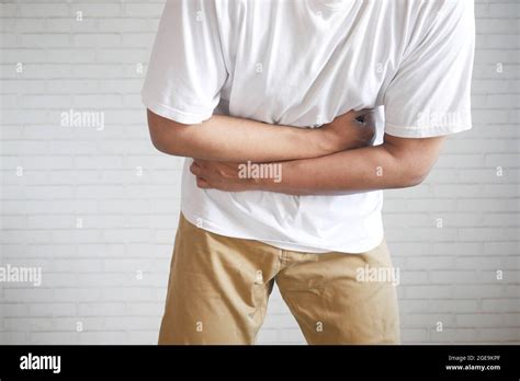 Young Man Suffering Stomach Pain Close Up Stock Photo Alamy