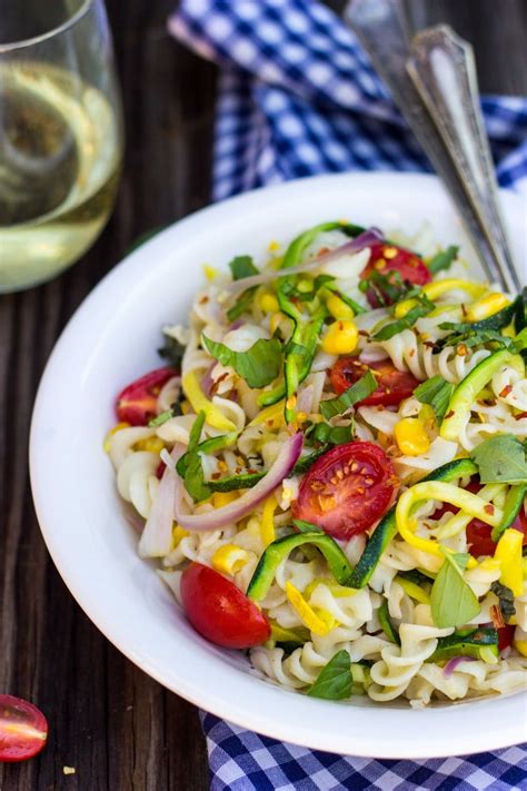 It's a pasta salad full of plenty of vegetables, cheese and tossed with a good vinaigrette. Summer Vegetable Pasta Salad - She Likes Food