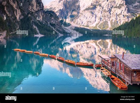 Wooden Boats In A Row On Summer Morning At Lago Di Braies Italy Stock