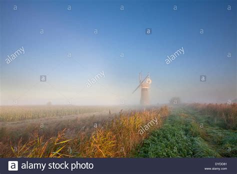 St Benets Mill On A Misty Morning On The Norfolk Broads Stock Photo Alamy