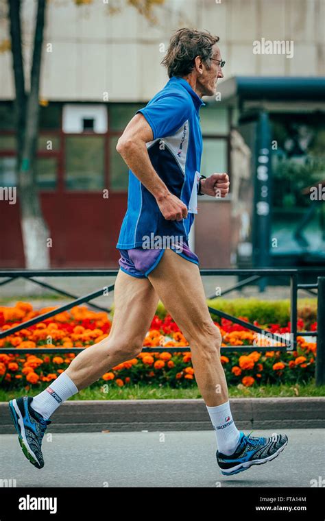 Old Man Running In The Street During Chelyabinsk Marathon Stock Photo