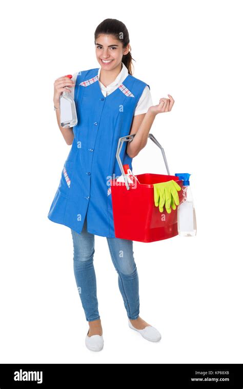 Happy Female Worker Carrying Bucket With Cleaning Equipment Stock Photo