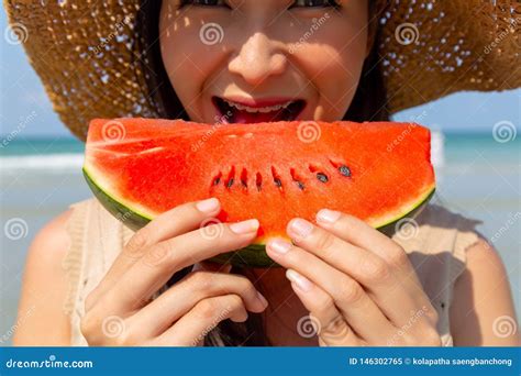 Charming Beautiful Young Woman Eating Watermelon To Cool Down And
