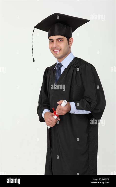 University Student Holding Graduation Degree Stock Photo Alamy