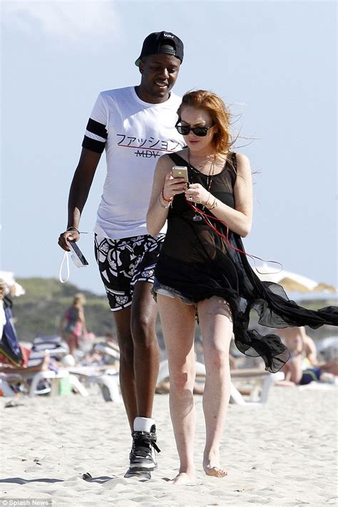 Lindsay Lohan Enjoys Leisurely Beach Stroll With Towies Vas J Morgan