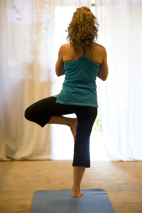 Woman Doing Yoga Routine On Blue Exercise Mat Free Image Peakpx