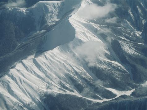 Premium Photo Aerial View Of Snow Covered Mountains