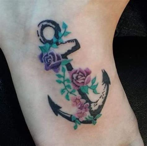 Anchor with pink flower accents. 30 Floral Anchor Tattoos For Women - TattooBlend