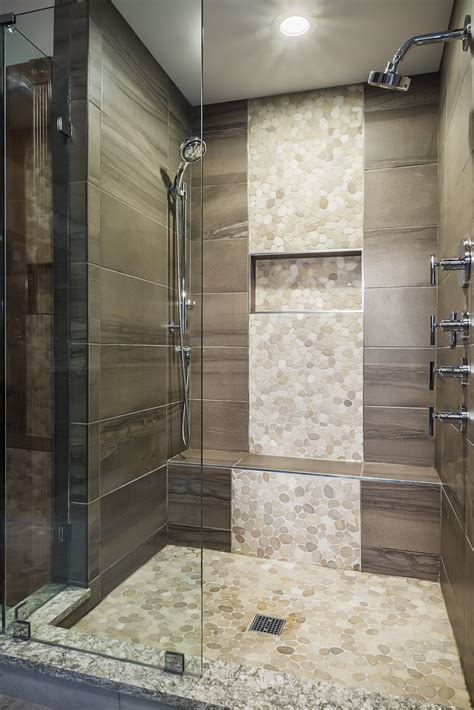 this luxury bathroom offers a spacious shower complete with a shower bench niche and multifunc