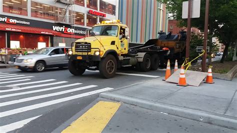 Nyc Dot Road Crew Transporting A Milling And Road Resurfacing Machine